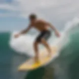 A skilled skimboarder riding the waves with precision