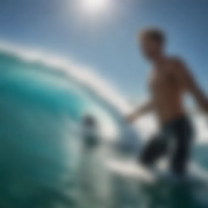 A surfer catching a wave in clear blue water