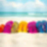 Colorful beach flip flops arranged on a sandy shore