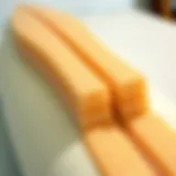 Detailed view of foam surfboard construction showcasing layers