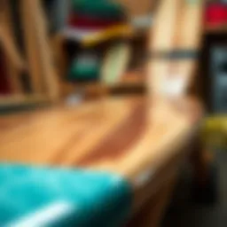 A selection of longboard materials showcasing wood, fiberglass, and carbon fiber for custom builds