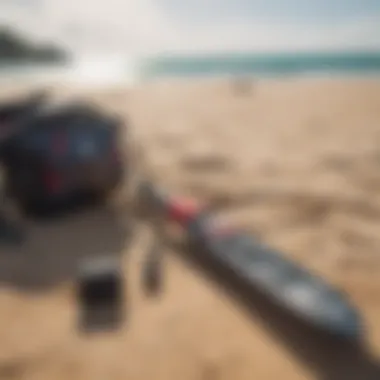 Essential kite gear laid out on a sandy beach