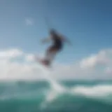 A stunning kite surfer riding the waves under a clear blue sky