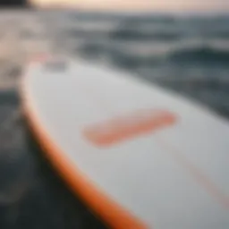 FCS fin key showcased on a surfboard