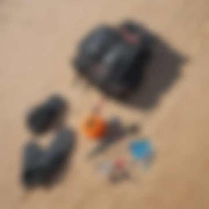 Kitesurfing equipment laid out on the sand