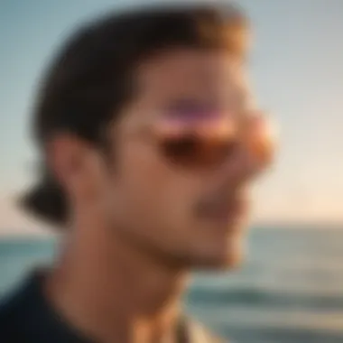 Stylish Oakley Feedback sunglasses in rose gold against a vibrant ocean backdrop