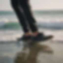 The Sanuk Black footwear displayed on a surfboard