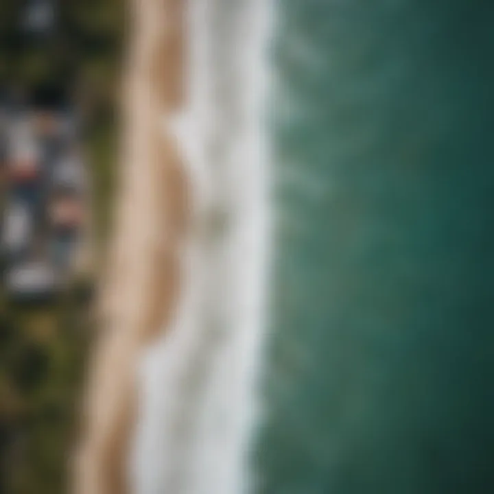 Aerial view of Kuta Beach with surfers riding the waves