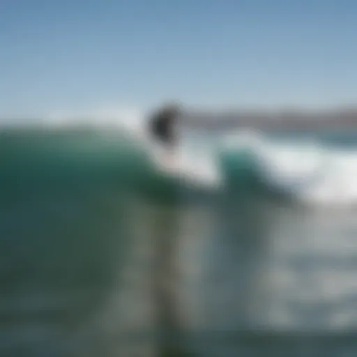 A surfer riding a wave at Camp Pendleton, showcasing the pristine ocean and coastline.