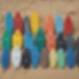 A vibrant collection of top body boards displayed on the beach.