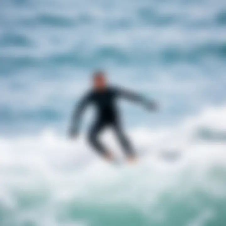 A surfer wearing a full body wetsuit riding a wave