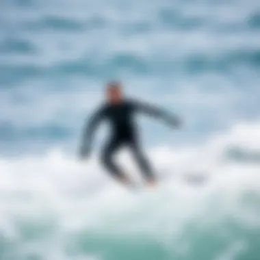 Surfer in Action A surfer wearing a full body wetsuit riding a wave