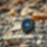 Garmin Instinct smartwatch displayed on a rocky beach