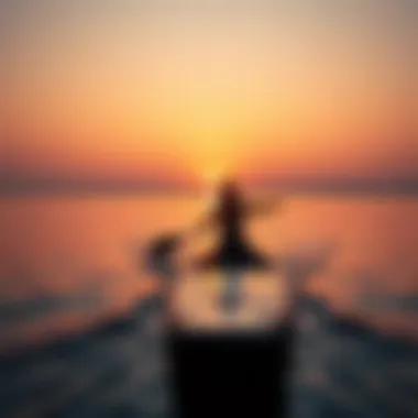 A paddleboarder navigating calm waters at sunset