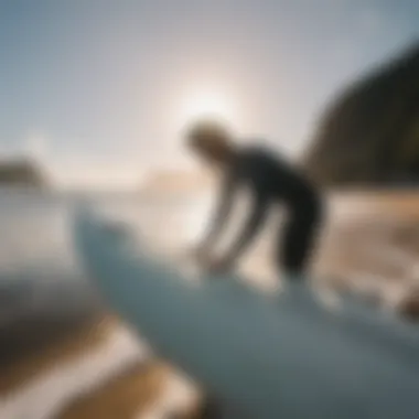 A surfer maintaining their surfboard, highlighting the importance of upkeep