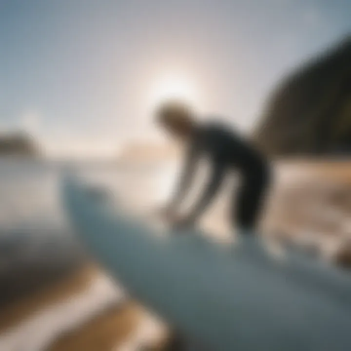 A surfer maintaining their surfboard, highlighting the importance of upkeep