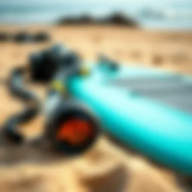Close-up of essential boogie boarding gear laid out on the sand