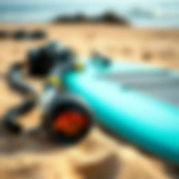 Close-up of essential boogie boarding gear laid out on the sand
