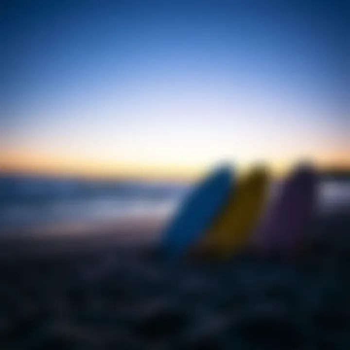 A serene beach sunset with boogie boards leaning against the shore