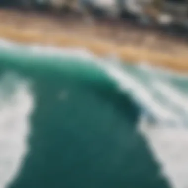 An aerial view of a live surfing competition, showcasing the crowd and surf conditions