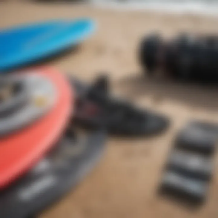 A close-up of essential kiteboarding gear laid out on the beach